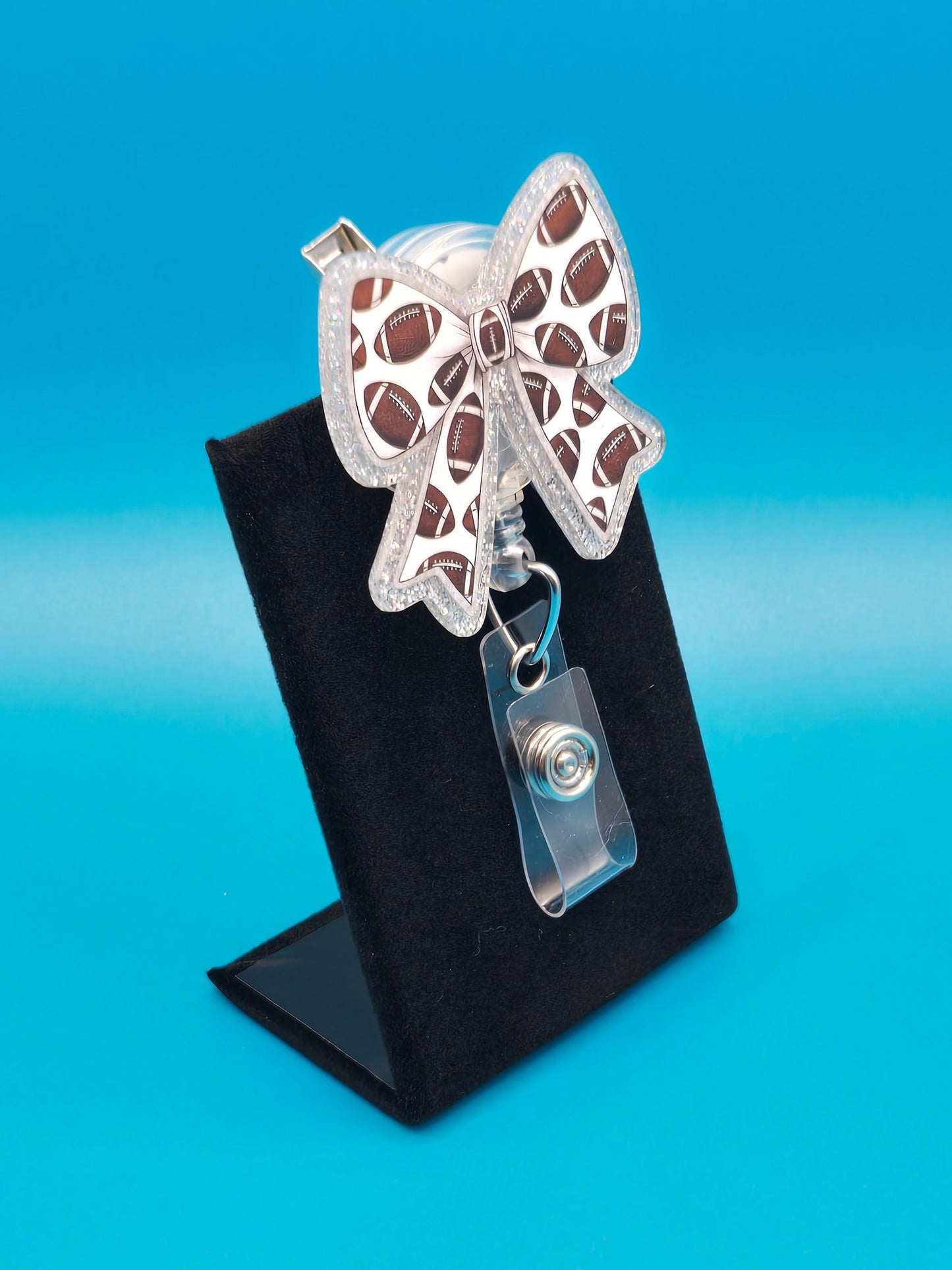 Sports Themed Bow with Footballs Acrylic Badge Reel