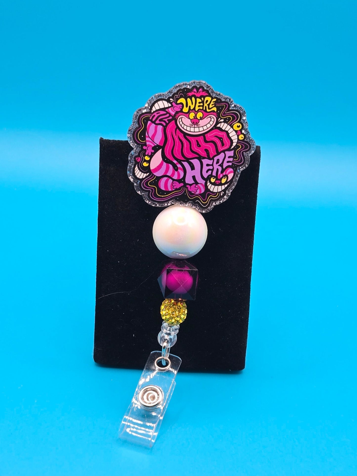 We're Mad Here Acrylic Badge Reel