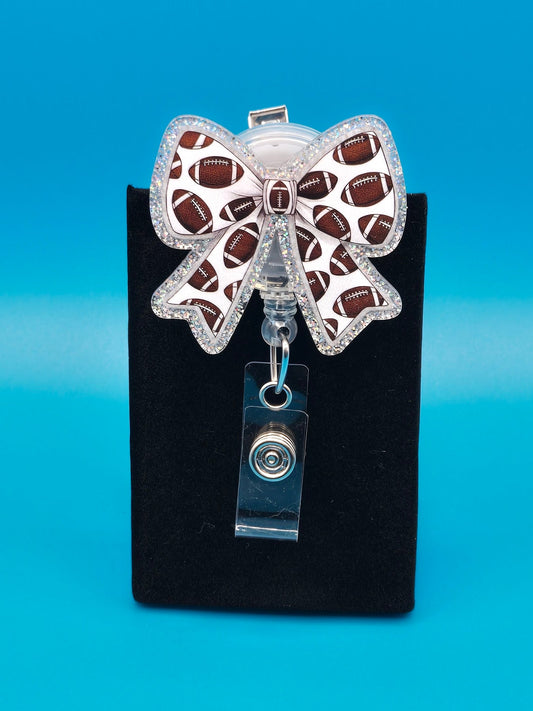 Sports Themed Bow with Footballs Acrylic Badge Reel