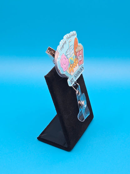 Motivated by Snacks Acrylic Badge Reel